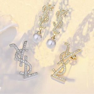 Stainless steel earrings YSL shaped. Silver needle diamonds